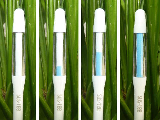 Four SusTee devices with blue and  white indicator bands against a green grass background